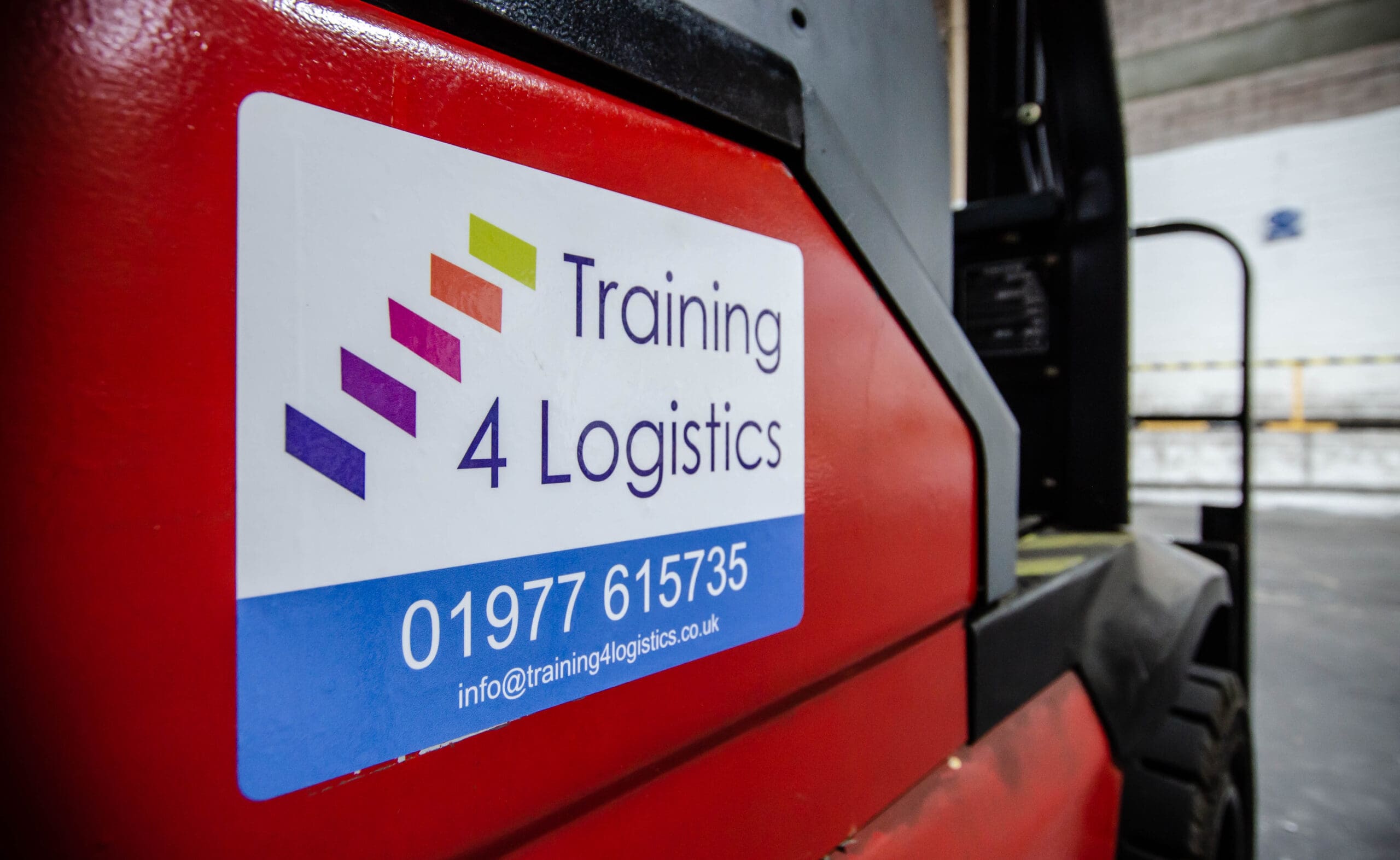 Forklift with training 4 logistics logo displayed